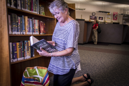 A Patron Browsing the New Book Section